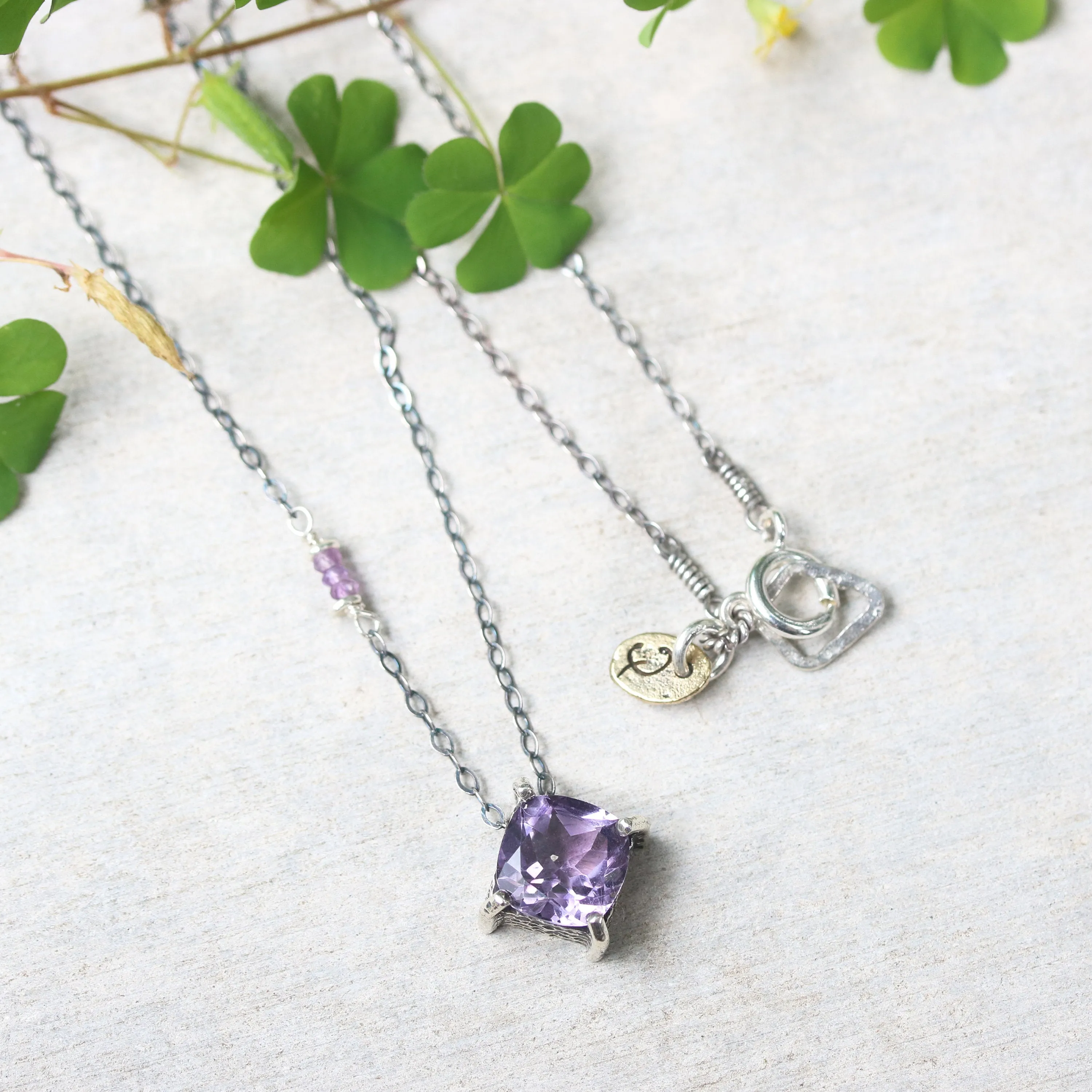 Cushion Amethyst pendant necklace in silver bezel and prongs setting with amethyst beads secondary on oxidized sterling silver chain