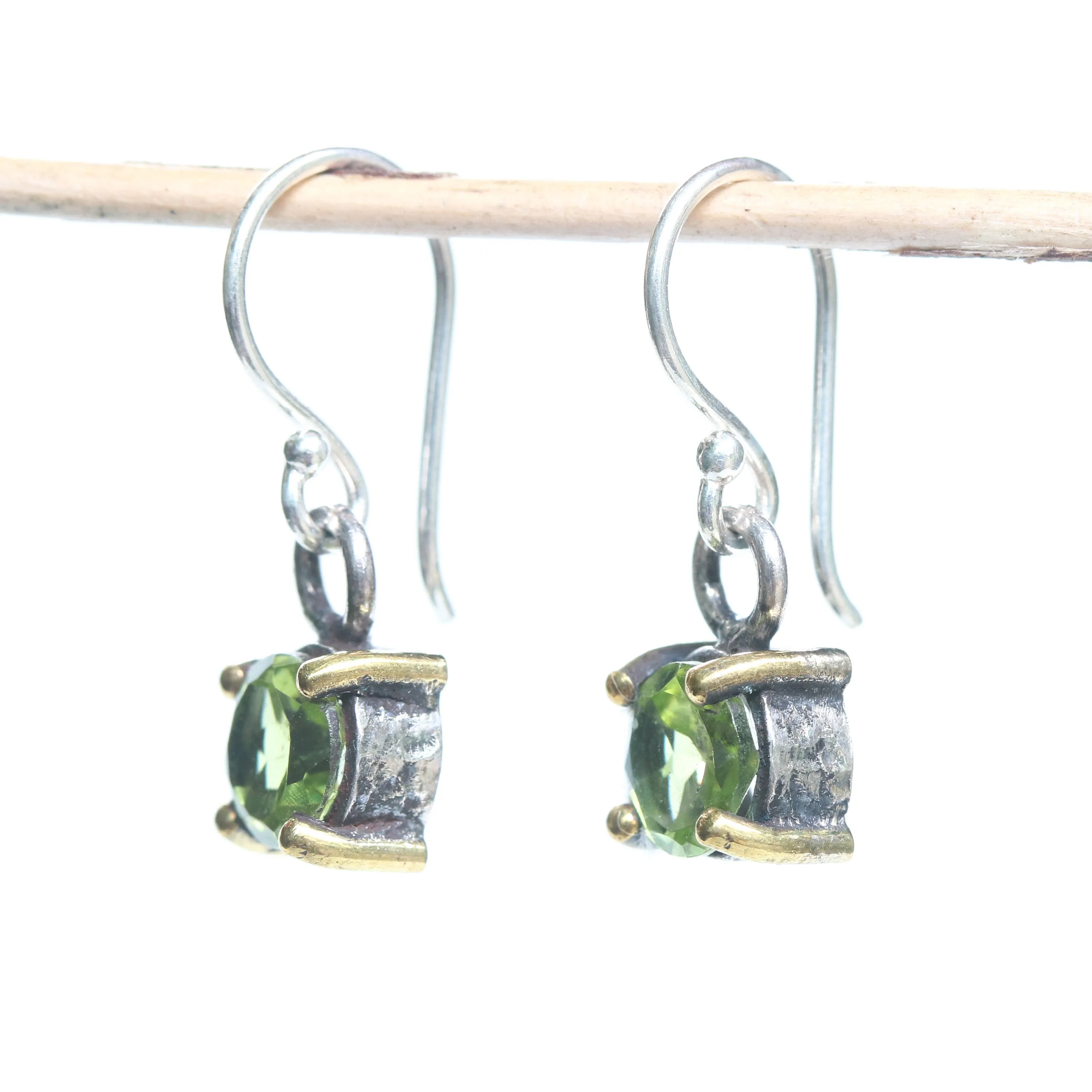 Earrings round faceted peridot in silver bezel and brass prongs setting with sterling silver hooks style