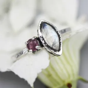 Marquise moonstone ring with pink tourmaline side set gems in bezel and prongs setting