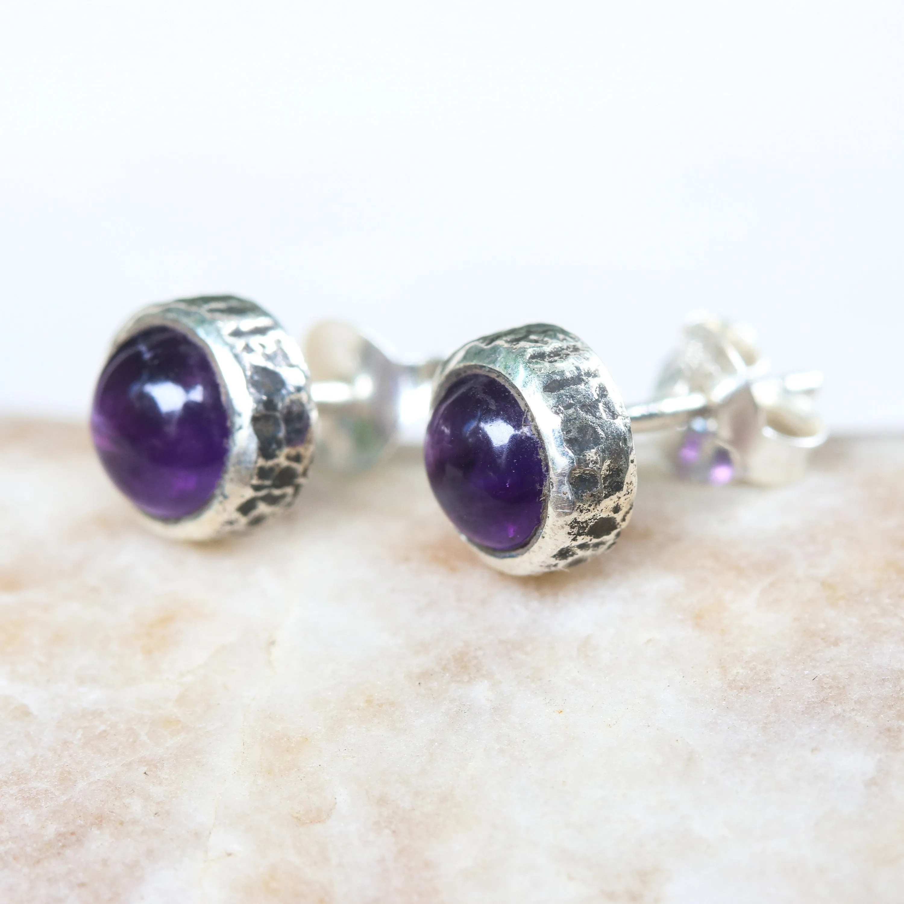 Round cabochon Amethyst earrings in silver bezel setting with sterling silver post and backing