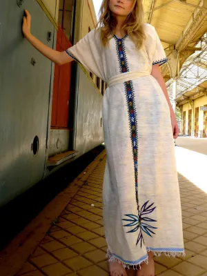 White traditional Ethiopian dress with multicolored embroidery